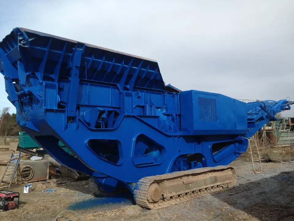 A full tracked crusher blasted and repainted blue on site