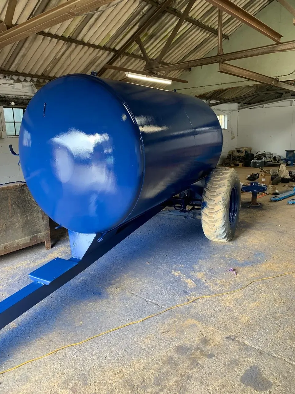 A steel water bowser blasted and spray painted gloss blue in the workshop